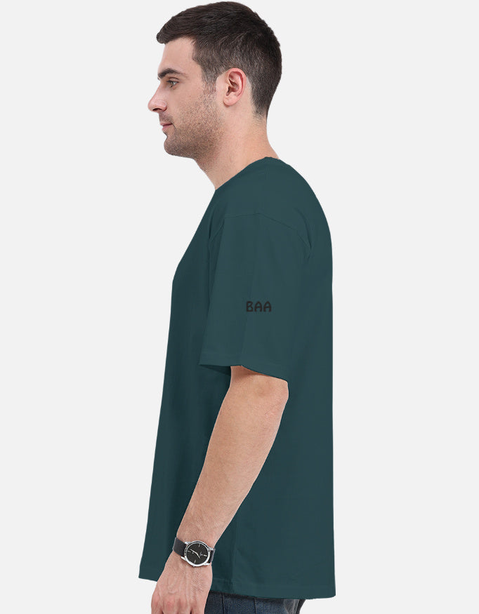 Man wearing a Petrol Blue  t-shirt with 'BAA' logo on a white background